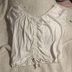 white blouse , kinda cropped